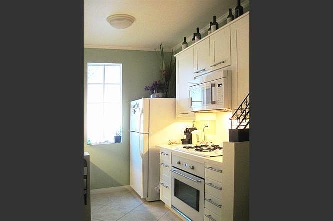 Kitchen - gas cook top, oven and microwave. Refrigerator has ice maker.