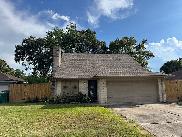 Street view with parking and azaleas.