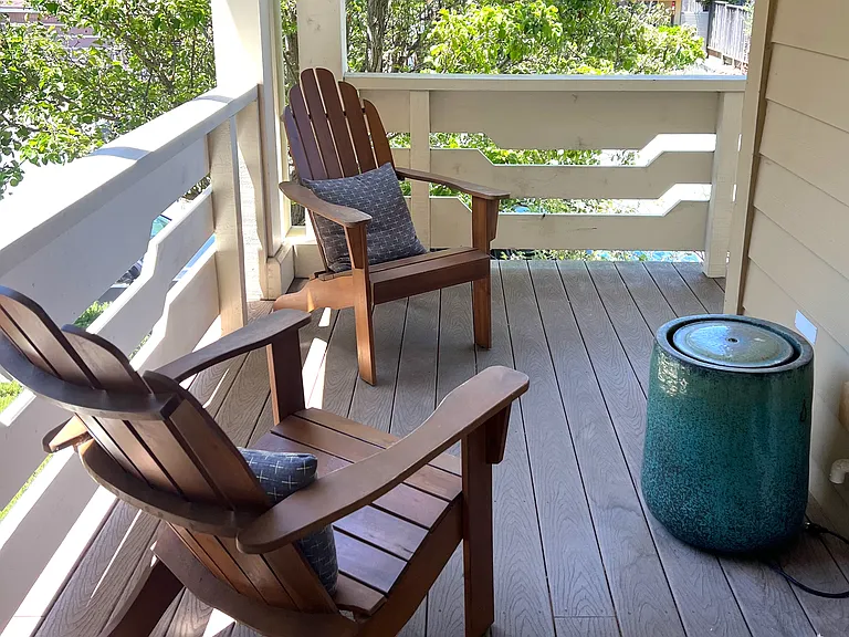 Front porch area shared by 2 tenants and owner. A great place to enjoy a cup of coffee or tea!
