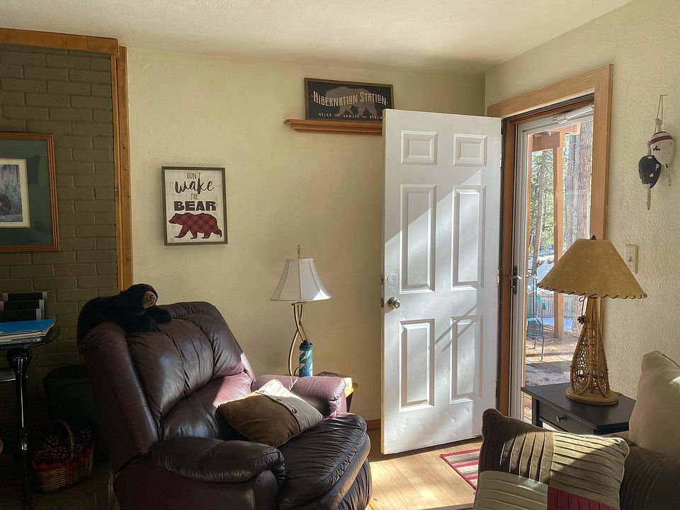 Sitting room leading out to deck furnished with BBQ, Tables and Chairs. Beautifully placed in woods. Your can use deck year round. A really nice quiet place added to apartment. Entrance is private and deck measures about T