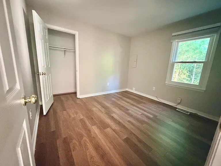 Bedroom 2 located downstairs with closet space