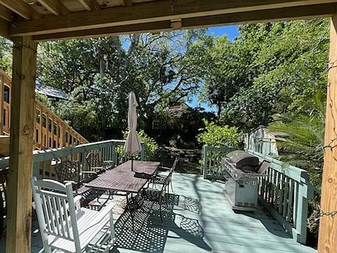View of backyard deck from door to dining room.