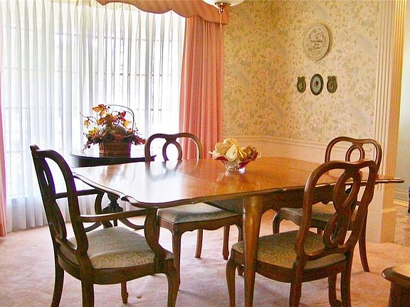Formal dining room with bay window.