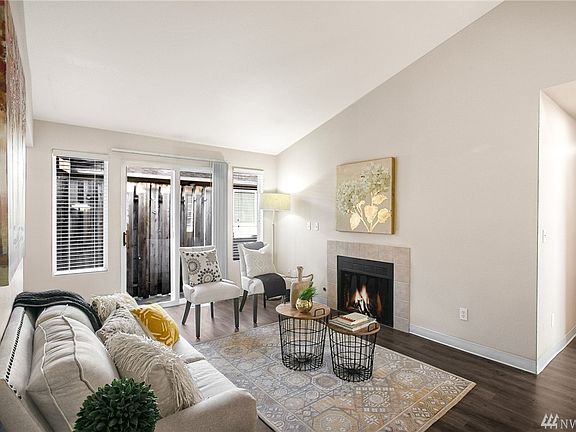 The gas fireplace creates a cozy ambience in the living room. 