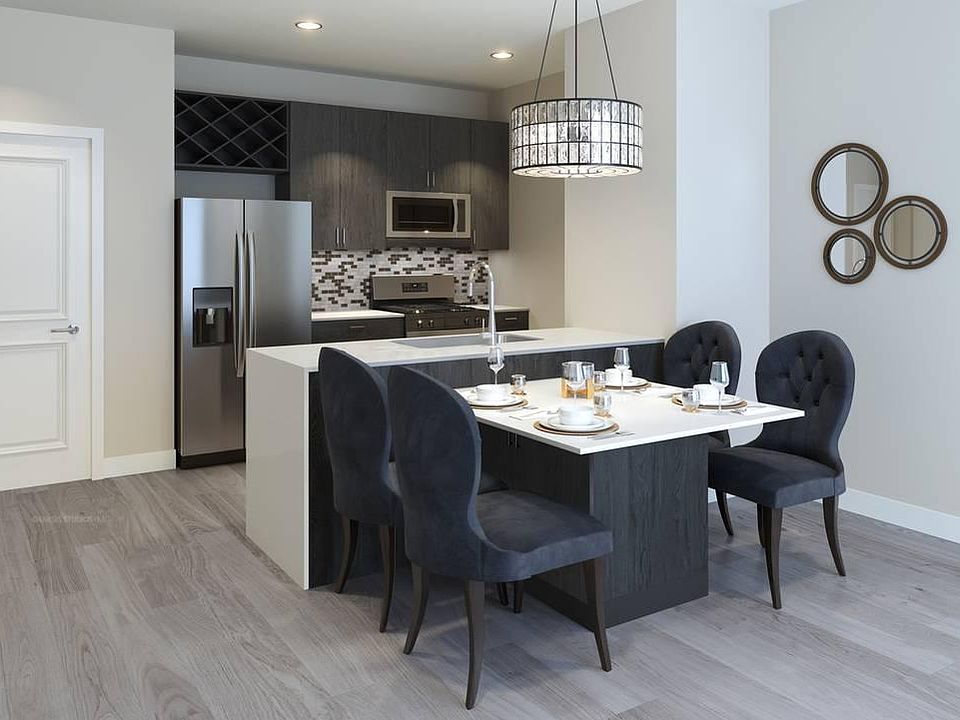 Gourmet Kitchens: Cook in style with Whirlpool stainless steel appliances, including a refrigerator with ice maker, dishwasher, and microwave. Enjoy the convenience of a Whirlpool front-loading washer and dryer in every unit.