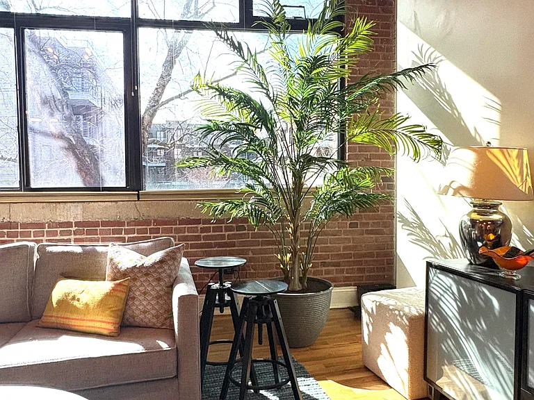 Industrial insulated and tinted windows let abundant, filtered light in from the Southern exposure. The sliding panel opens to a screened window, a rarity in Factory South.