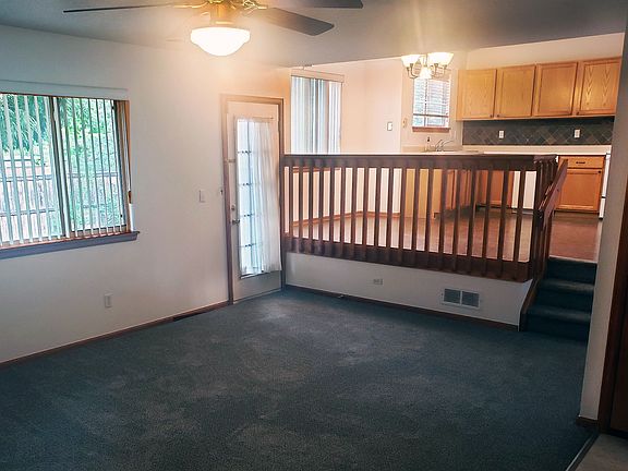 View from the family room to the dining area and kitchen