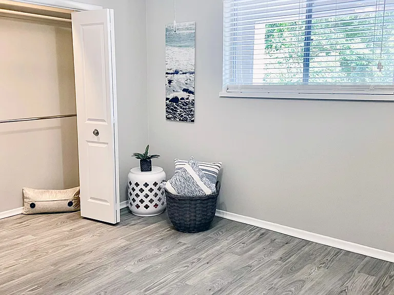 Surrender to dreamy bedrooms adorned with the warmth of wood-style flooring, expansive closets with built-in organizers, and gentle breezes from lighted ceiling fans for the ultimate comfort.