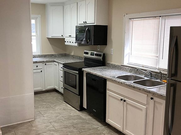 KITCHEN W/ TILED FLOORS AND NEW APPLIANCES W/ LOTS OF STORAGE