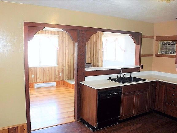 Kitchen overlooks Living Room.  The sink per seller is a new extra-deep "Blanco" design.