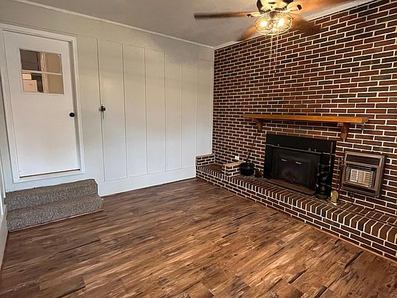 Den with fireplace and new LVP