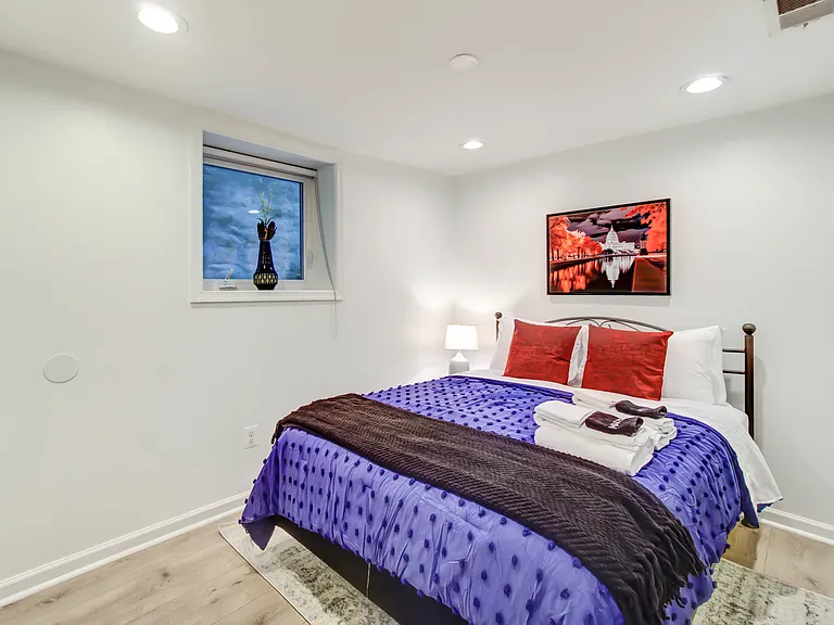 The second bedroom is thoughtfully situated toward the rear of the apartment and features a large window, creating a comfortable and inviting retreat.