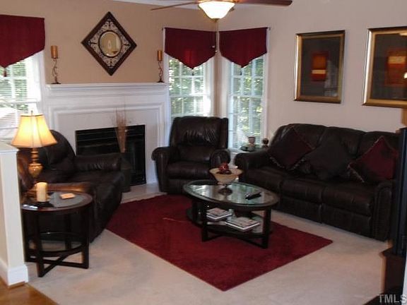 Family room is open to kitchen and has wood burning fireplace.