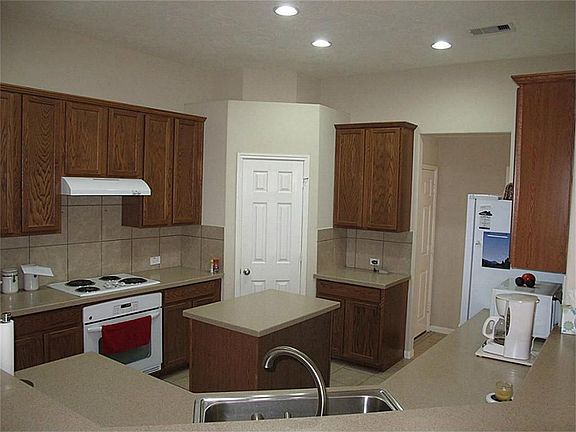 Gourmet island kitchen - so much counter space & cabinetry!