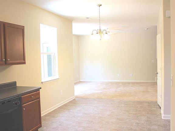 Looking from Kitchen toward Living Room. Downstairs has high ceilings and open floor plan. 
Picture does not show that the entire first floor has beautiful, brand new luxury vinyl plank flooring.