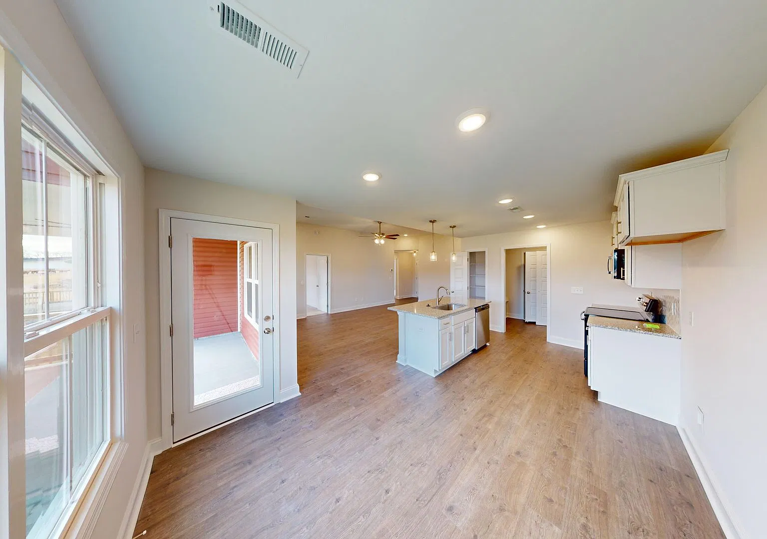 Stylish Home with Large Kitchen Island, Open Layout, and Premium Upgrades — Photo 4