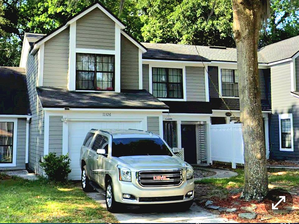 Front of house (left of White fence to corner of garage)