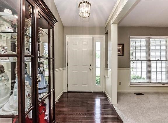 Welcome guests into your home thru the cheerful entry featuring wood floors.