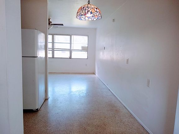 View from Kitchen and kitchen area to living room. Terrazzo floors