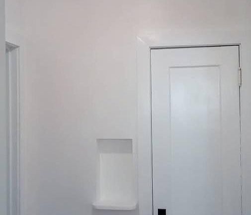 Foyer w/ hall closet and old style phone shelf
