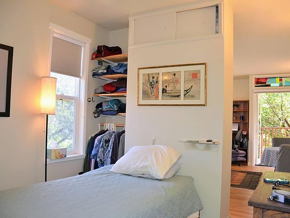 The bedroom is shown furnished to illustrate the layout. Unit is offered unfurnished.