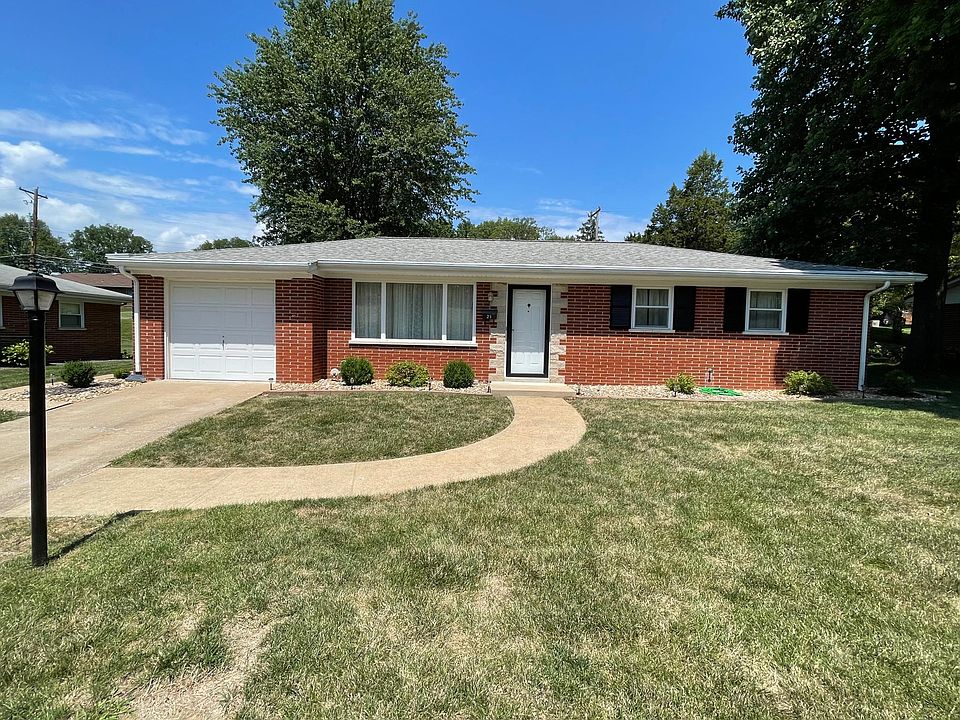 All brick home with single car garage attached.