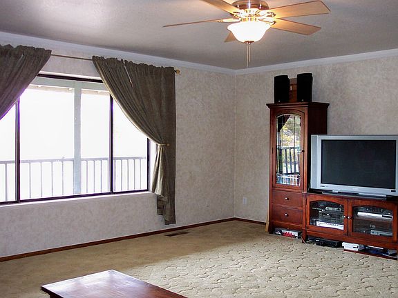The family room faces west but is cooled by the covered porch.
