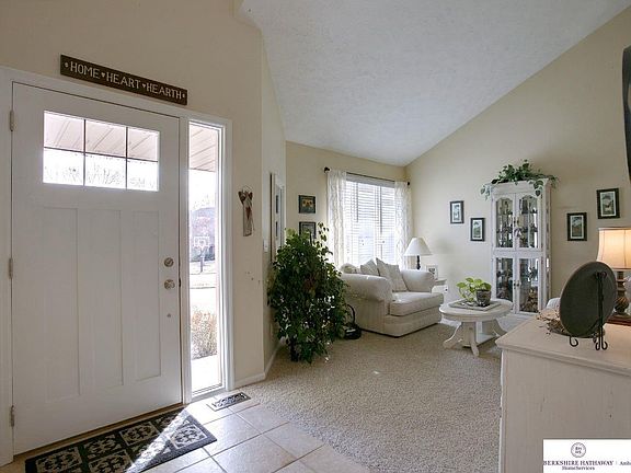 Majestic vaulted ceiling and plush carpeting make this room a pleasure to have some relaxing conversation.