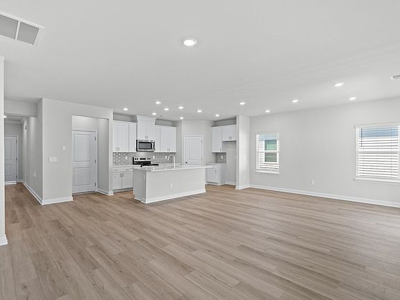 The kitchen overlooks the dining area and great room.