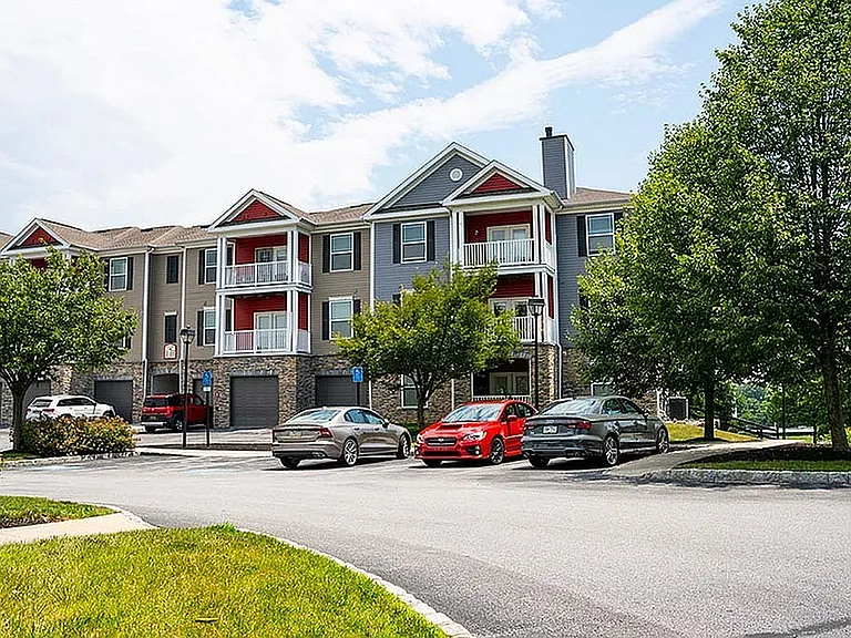 Explore this charming apartment community featuring stylish architecture and lush landscaping.