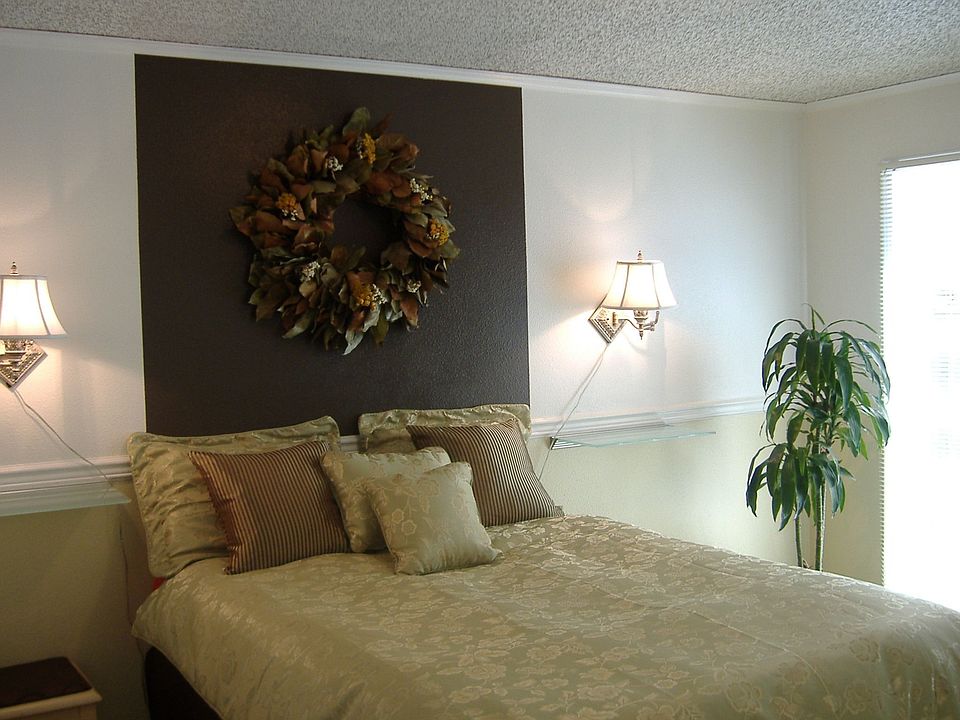 Master bedroom w/ glass doors leading out to private seating area