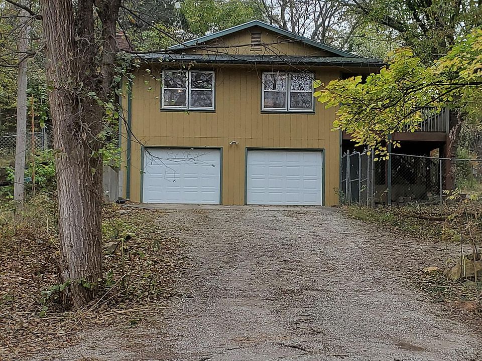 Two car garage with remotes to open doors.