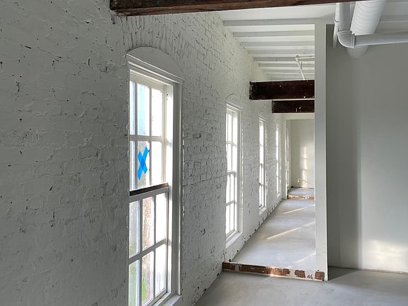 Loft hallway showing numerous windows and great natural light.