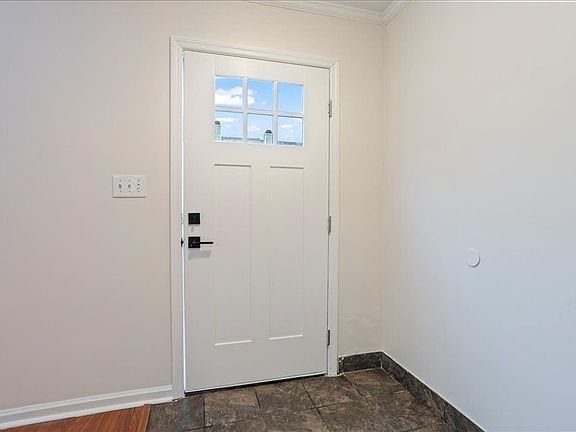 Front door opens to Living Room