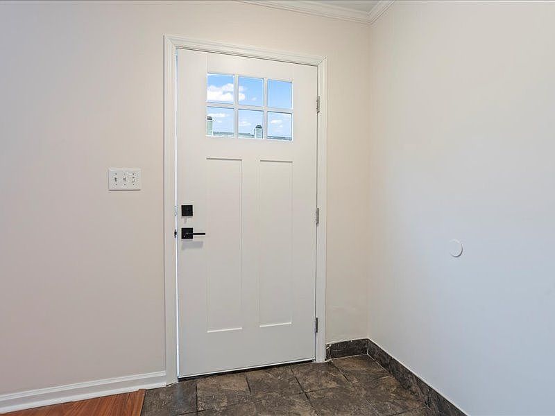 Front door opens to Living Room