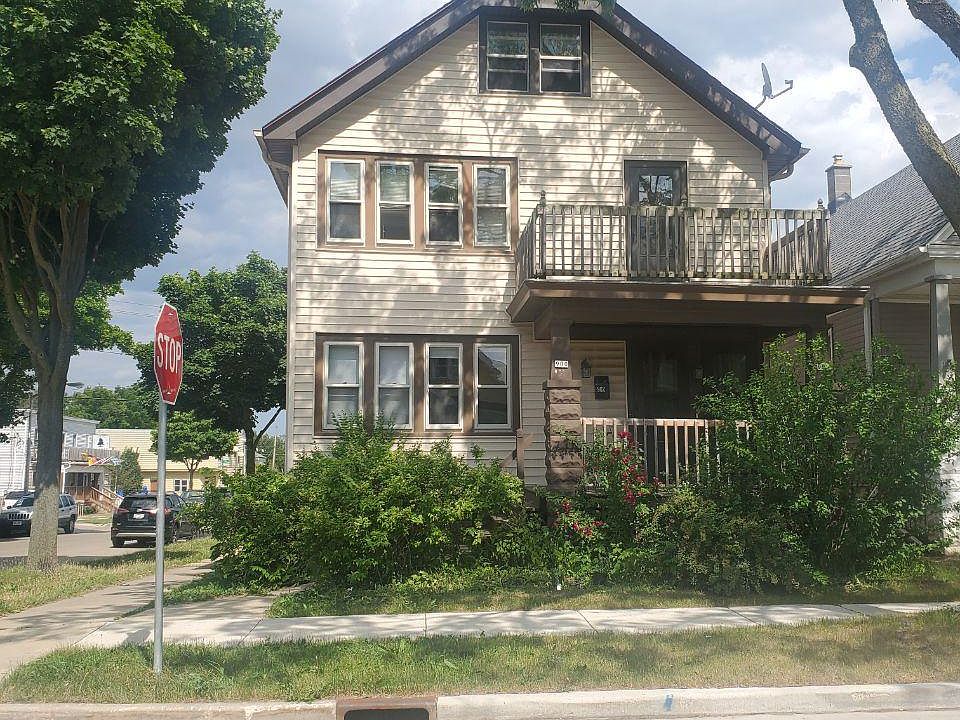 Front view. Free, uncovered street parking, covered front porch