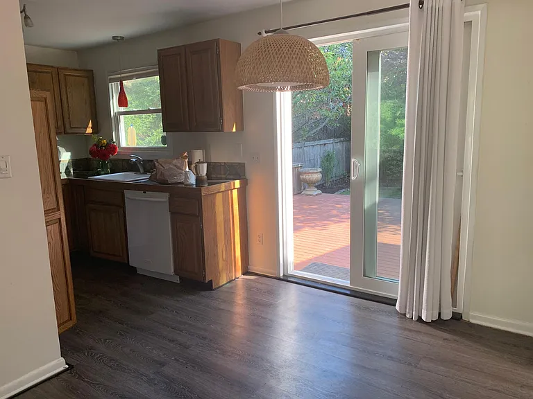 Dining room, kitchen, sliding door to deck and backyard