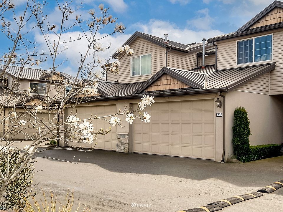 Front of unit with 2 car garage.