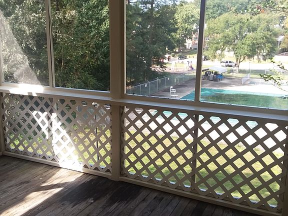 Sun porch looking out over pool and playground