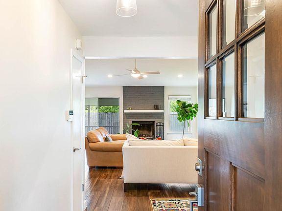 New stained wood front door greets your guests.