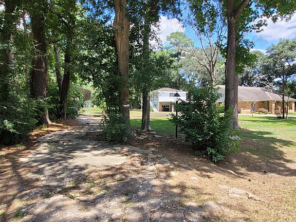 Driveway to RV shed. Tree in driveway has been removed.