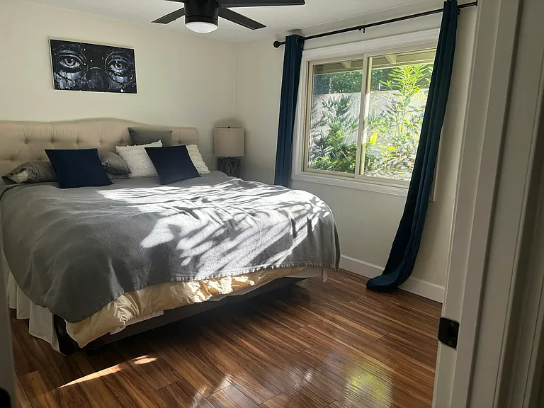 Primary Bedroom, Pictured: King Size Bed, Two End Tables, Closet, View From Backyard, Neighborhood, Privacy