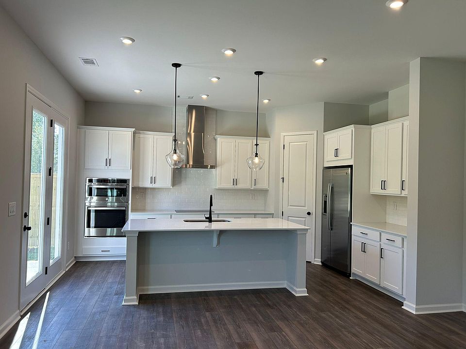 open kitchen with built in cabinets and brand new appliances
