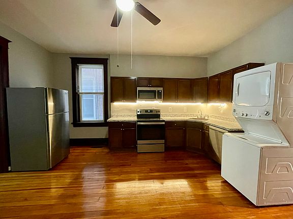 Updated kitchen with cabinet lighting, dishwasher, stainless steel appliances and washer and dryer.