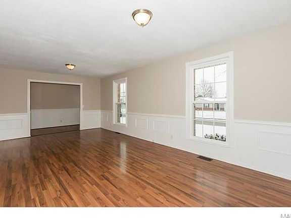 Another view of the living room from doorway to kitchen.