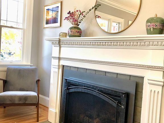 gas fire place, window facing west and out to front porch