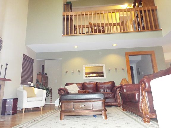 Living Room with wood burning fire place and Loft