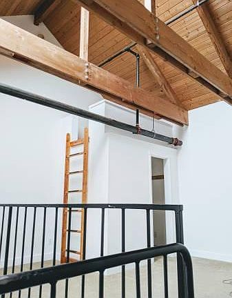 Bedroom with walk-in closet, storage on top