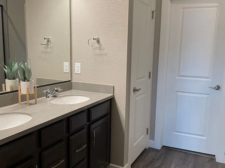 Ensuite master bathroom with walk-in closet on main level