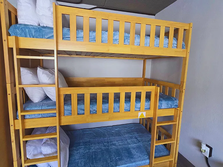 Cozy bunk for three with high-quality linens and pillows